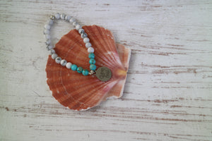 White howlite and blue sea sediment jasper gemstone beaded bracelet with silver 'gypsy soul' charm