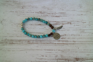 Blue Sea Sediment Jasper and wood beaded bracelet with silver 'mermaid soul' and boho feather charm
