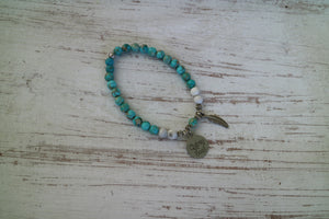 Blue Sea Sediment Jasper with white Howlite bead bracelet with silver 'gypsy soul' and feather charms