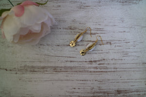 White and gold cowrie sea shell earrings with gold plated charms