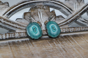 Green solar quartz crystal earrings with black electroplated edges and silver stainless steel earring hooks