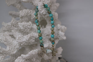 Blue Sea Sediment Jasper gemstone beads with Larimar nugget bead and silver 'love faith hope' and turtle charms