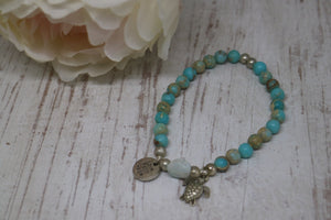 Blue Sea Sediment Jasper gemstone beads with Larimar nugget bead and silver 'love faith hope' and turtle charms