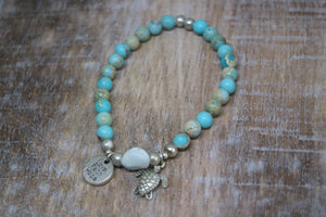 Blue Sea Sediment Jasper gemstone beads with Larimar nugget bead and silver 'love faith hope' and turtle charms