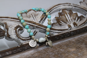 Blue Sea Sediment Jasper gemstone beads with Larimar nugget bead and silver 'love faith hope' and turtle charms