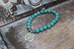Blue Turquoise bead bracelet with a silver 'dreaming of the sea' rustic charm