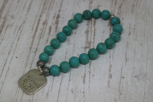 Blue Turquoise bead bracelet with a silver 'dreaming of the sea' rustic charm