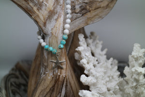 White howlite and blue sea sediment jasper gemstone beaded bracelet with silver starfish charm