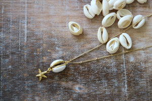 Gold shell necklace with starfish charm