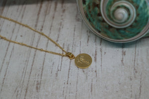 Gold palm tree coin necklace