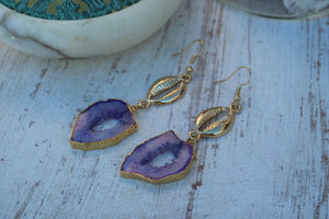 Purple Goede Druzy Agate earrings with gold plated edges and gold plated cowrie shell connectors