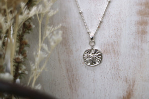 Silver sand dollar shell necklace