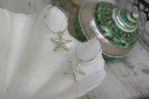 Silver starfish hoop earrings