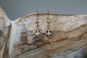 Gold cubic zirconia peace earrings