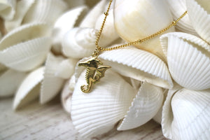 Gold seahorse necklace