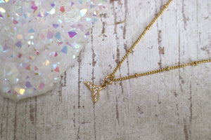Gold whale tail children's necklace with cubic zirconia