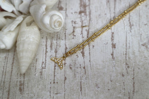 Gold whale tail children's necklace with cubic zirconia