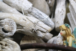 Children's silver starfish necklace with cubic zirconia
