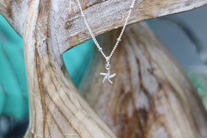 Children's silver starfish necklace with cubic zirconia