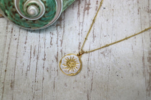 Gold and white moon and sun pendant necklace