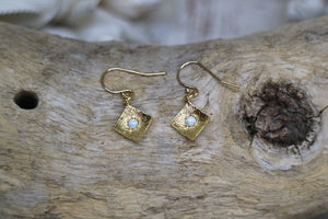 White opal gold earrings