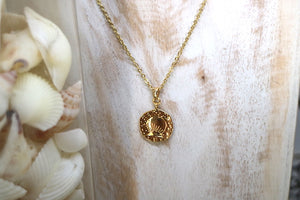 Gold shell coin pendant necklace