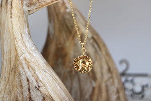 Gold shell coin pendant necklace