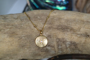 White opal and cubic zirconia coin gold necklace