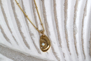 White opal and cubic zirconia moon and stars gold necklace