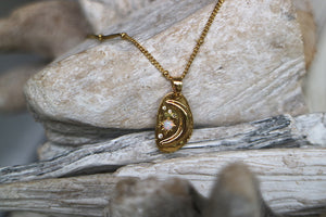 White opal and cubic zirconia moon and stars gold necklace