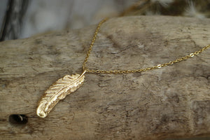 Gold feather necklace