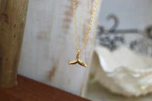 Gold whale tail necklace