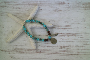 Blue Sea Sediment Jasper and wood beaded bracelet with silver 'mermaid soul' and boho feather charm