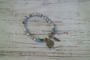 White Howlite beaded bracelet with Larimar nugget beads and a silver 'mermaid soul' and boho feather charm
