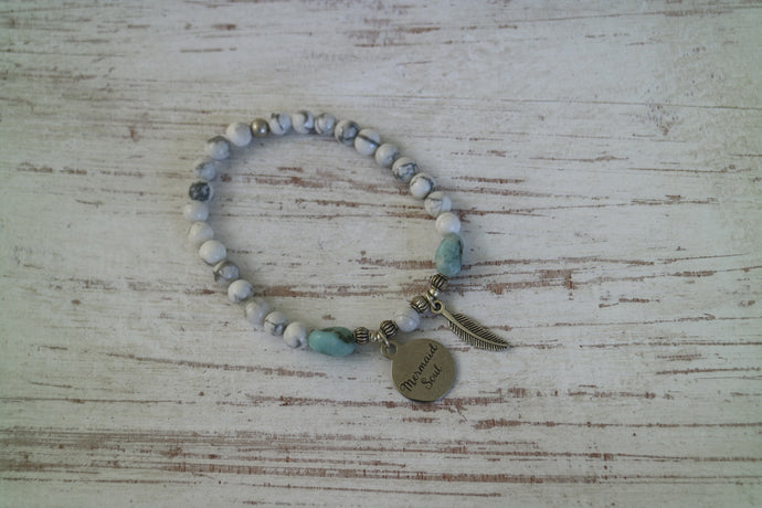 White Howlite beaded bracelet with Larimar nugget beads and a silver 'mermaid soul' and boho feather charm