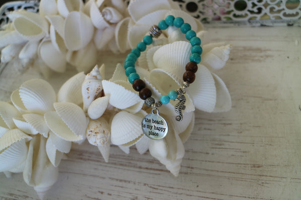 Load image into Gallery viewer, Turquoise gemstone and wood beaded bracelet with silver &#39;the beach is my happy place&#39; and seahorse charms
