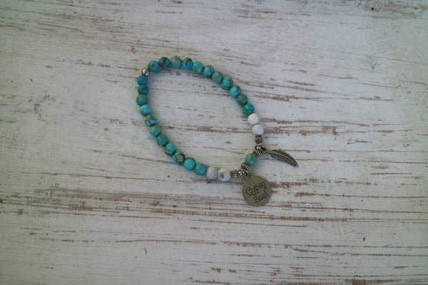 Load image into Gallery viewer, Blue Sea Sediment Jasper with white Howlite bead bracelet with silver &#39;gypsy soul&#39; and feather charms
