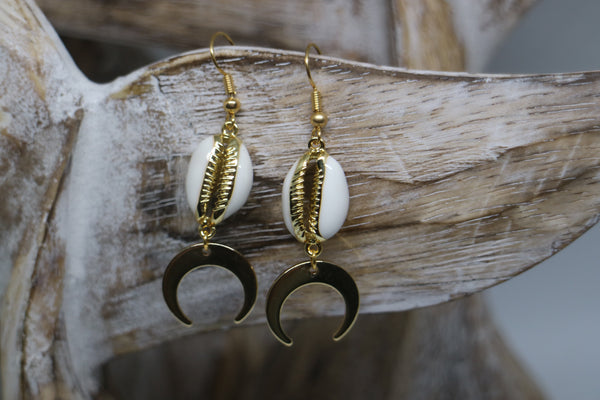 Load image into Gallery viewer, White cowrie sea shell gold earrings with gold plated moon charms
