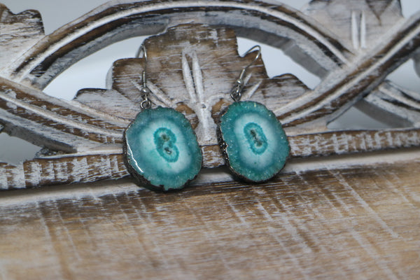 Load image into Gallery viewer, Green solar quartz crystal earrings with black electroplated edges and silver stainless steel earring hooks
