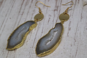 White goede druzy agate earrings with gold plated edges, and 24k gold plated charms