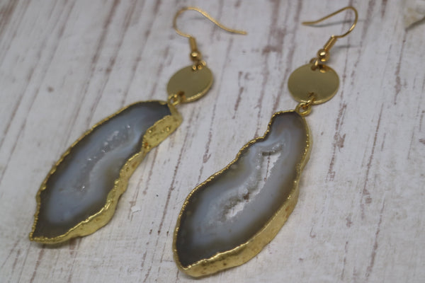 Load image into Gallery viewer, White goede druzy agate earrings with gold plated edges, and 24k gold plated charms
