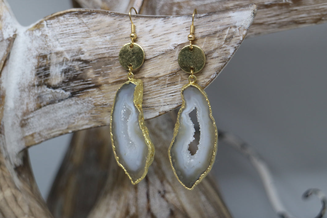 White goede druzy agate earrings with gold plated edges, and 24k gold plated charms