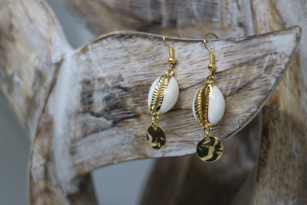 Load image into Gallery viewer, White and gold cowrie sea shell earrings with gold plated charms
