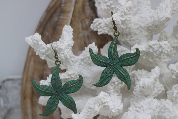 Load image into Gallery viewer, Bronze green patina starfish earrings

