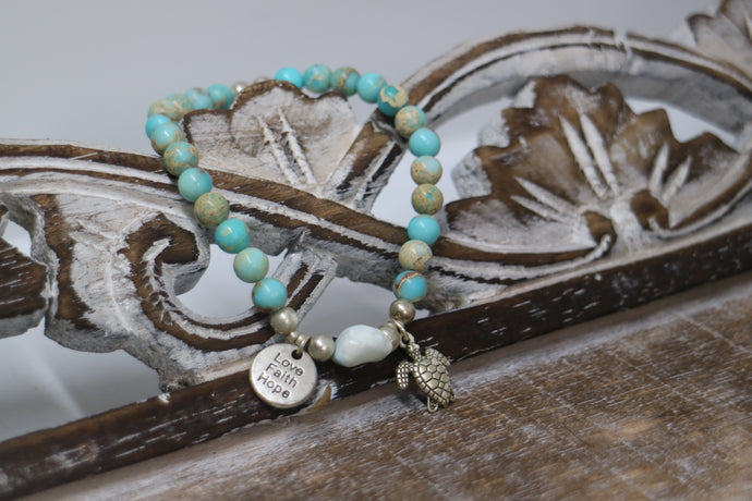 Blue Sea Sediment Jasper gemstone beads with Larimar nugget bead and silver 'love faith hope' and turtle charms