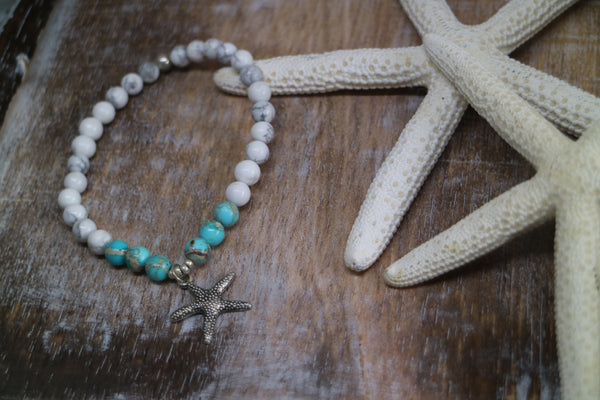 Load image into Gallery viewer, White howlite and blue sea sediment jasper gemstone beaded bracelet with silver starfish charm
