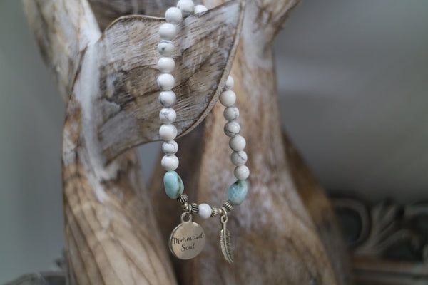 Load image into Gallery viewer, White Howlite beaded bracelet with Larimar nugget beads and a silver &#39;mermaid soul&#39; and boho feather charm
