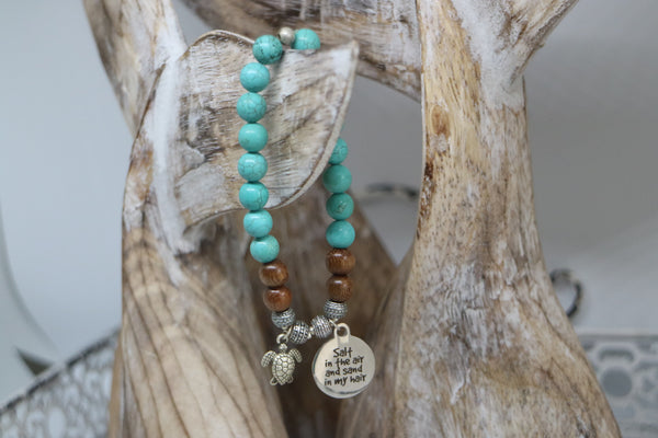 Load image into Gallery viewer, Turquoise and wood beaded bracelet with silver &#39;salt in the air and sand in my hair&#39; and turtle charm
