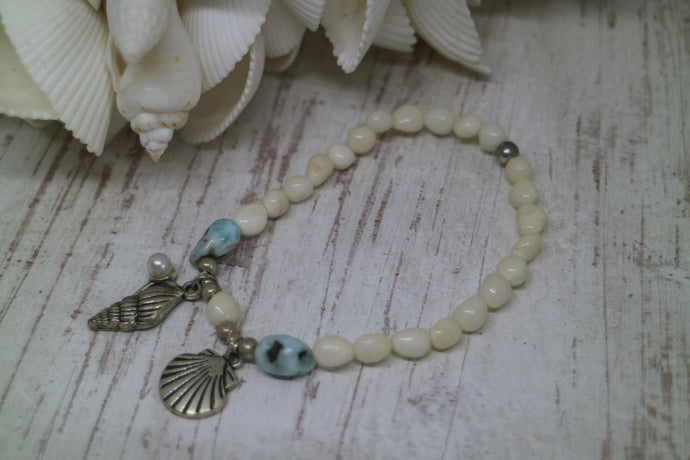 White shell Larimar gemstone bracelet with silver shell charms