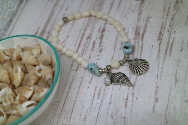 Load image into Gallery viewer, White shell Larimar gemstone bracelet with silver shell charms
